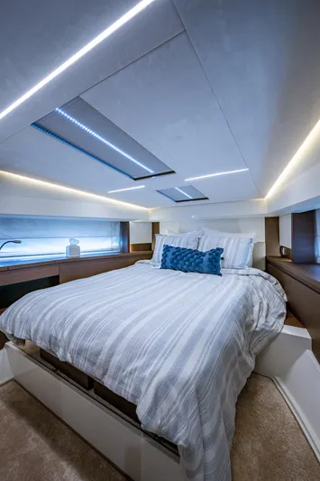 Pamper You Yacht Photos Pics Luxurious bedroom interior of 2019 Prestige 460 yacht with modern lighting and cozy bedding.