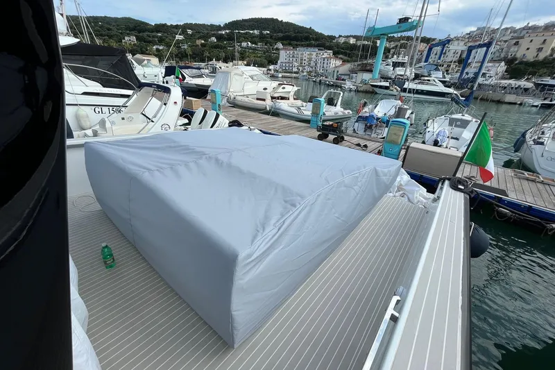 Yacht Photos Pics Fiart Seawalker 43 yacht docked at marina, covered deck, Italian flag visible.