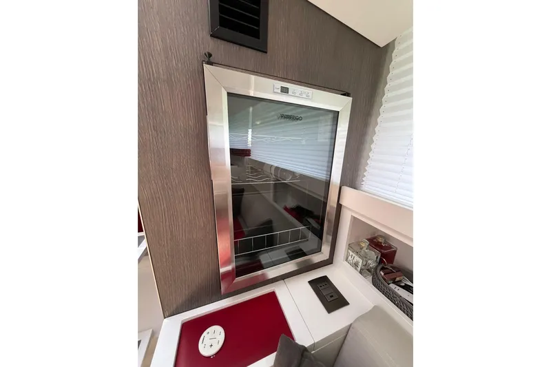  Yacht Photos Pics Modern interior of 2021 Fiart Seawalker 43 yacht featuring a sleek glass cabinet.