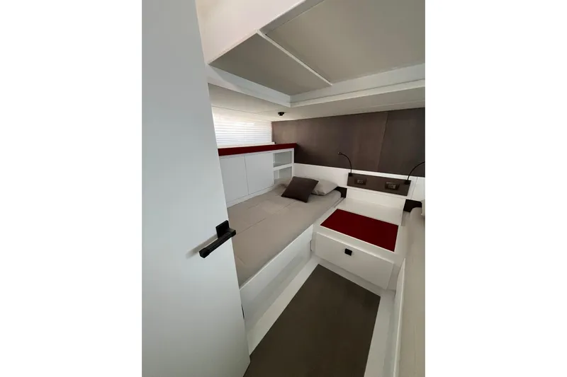  Yacht Photos Pics Interior cabin of 2021 Fiart Seawalker 43 yacht, featuring modern design and cozy bedding.