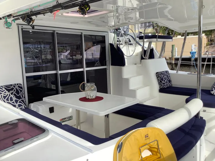 Merry Mac Yacht Photos Pics Luxurious 2013 Leopard 44 catamaran interior with seating, table, and helm station.
