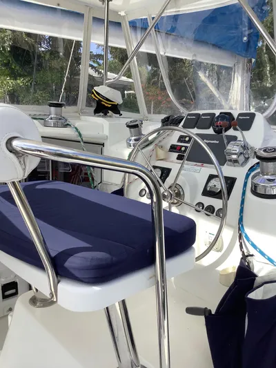 Merry Mac Yacht Photos Pics Helm station of 2013 Leopard 44 catamaran with steering wheel and navigation controls.