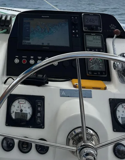 Merry Mac Yacht Photos Pics Steering wheel and navigation instruments on a 2013 Leopard 44 catamaran.