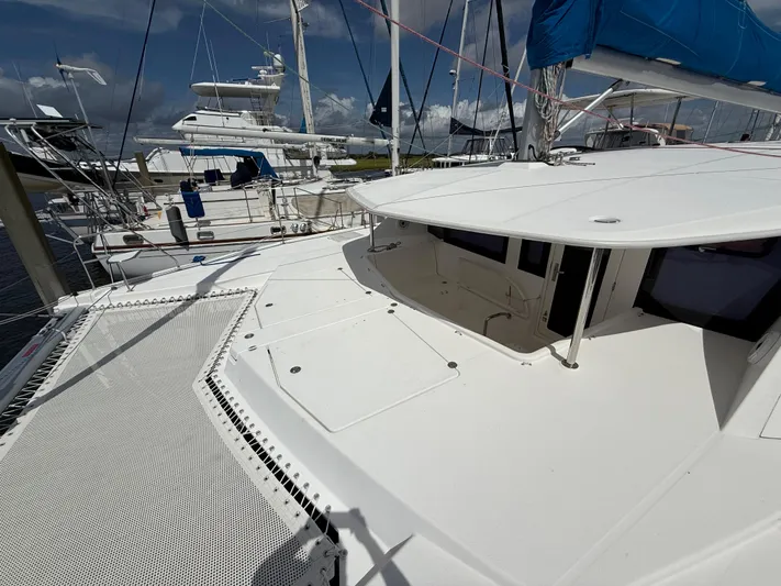 Merry Mac Yacht Photos Pics 2013 Leopard 44 catamaran docked, featuring spacious deck and modern design.