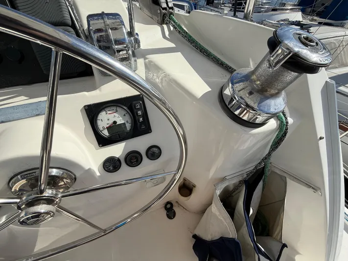 Merry Mac Yacht Photos Pics Steering wheel and controls on a 2013 Leopard 44 sailboat deck.