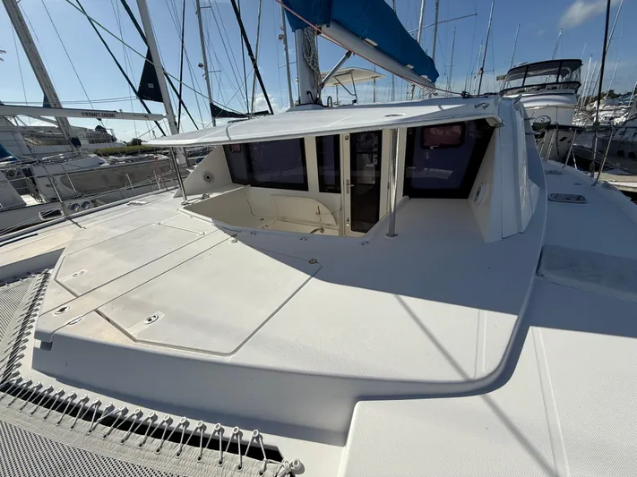 Merry Mac Yacht Photos Pics 2013 Leopard 44 catamaran docked, featuring spacious deck and modern design.