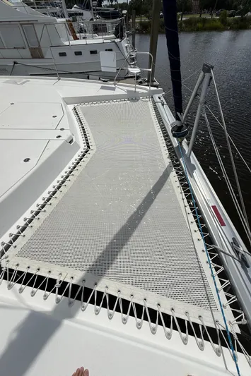 Merry Mac Yacht Photos Pics Leopard 44 catamaran deck with netting, docked by the water, 2013 model.