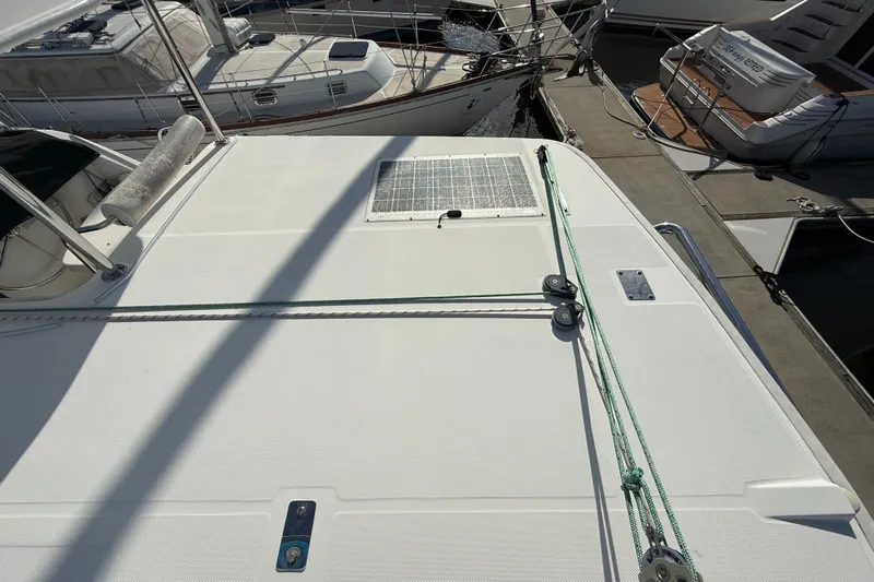 Merry Mac Yacht Photos Pics Deck of 2013 Leopard 44 catamaran with solar panel and mooring lines at marina.
