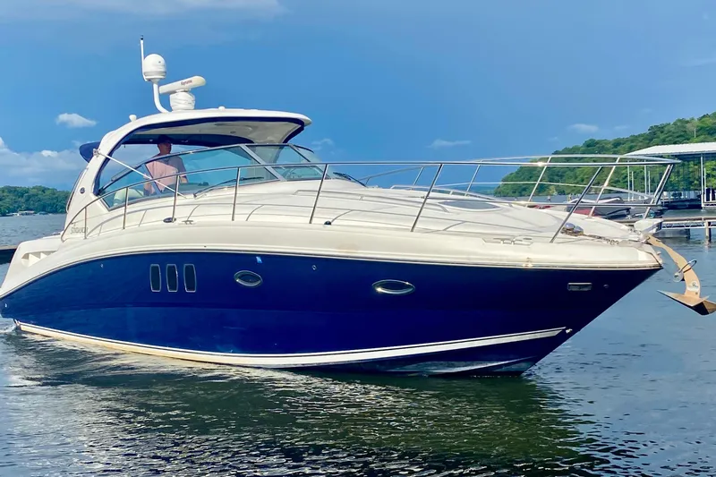  Yacht Photos Pics 2007 Sea Ray 38 Sundancer yacht cruising on a sunny day, with clear blue skies.