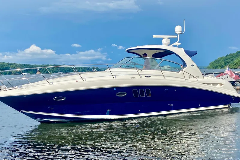  Yacht Photos Pics 2007 Sea Ray 38 Sundancer yacht on calm water, clear sky background.