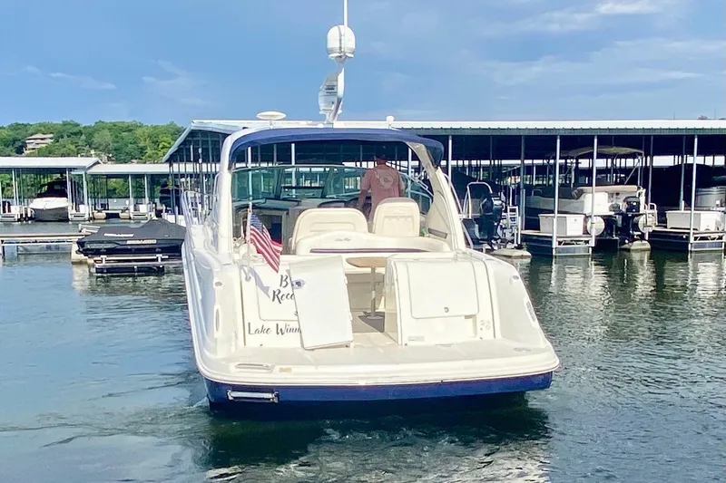  Yacht Photos Pics 2007 Sea Ray 38 Sundancer yacht docked at marina with American flag.