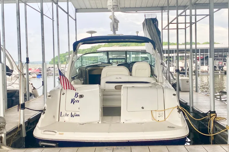  Yacht Photos Pics 2007 Sea Ray 38 Sundancer docked at marina with American flag.