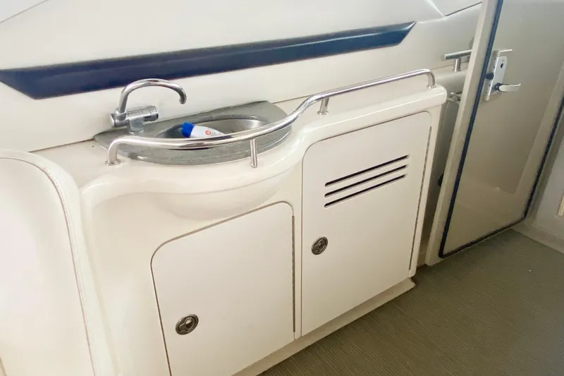  Yacht Photos Pics 2007 Sea Ray 38 Sundancer yacht interior with sink and storage cabinets.