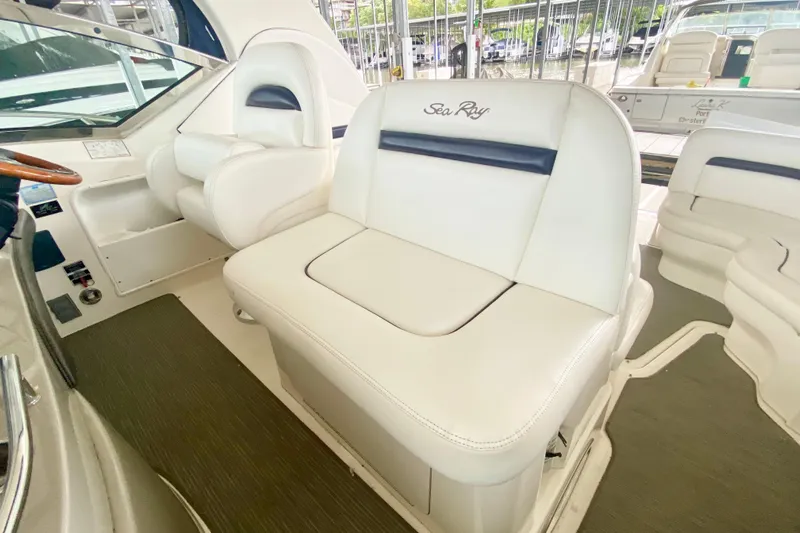  Yacht Photos Pics 2007 Sea Ray 38 Sundancer interior with white leather seating and helm area.