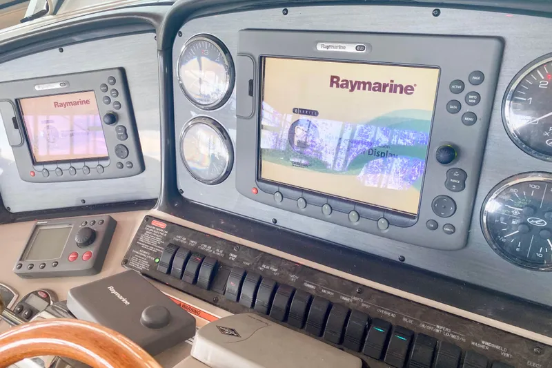  Yacht Photos Pics 2007 Sea Ray 38 Sundancer dashboard with Raymarine navigation displays and controls.