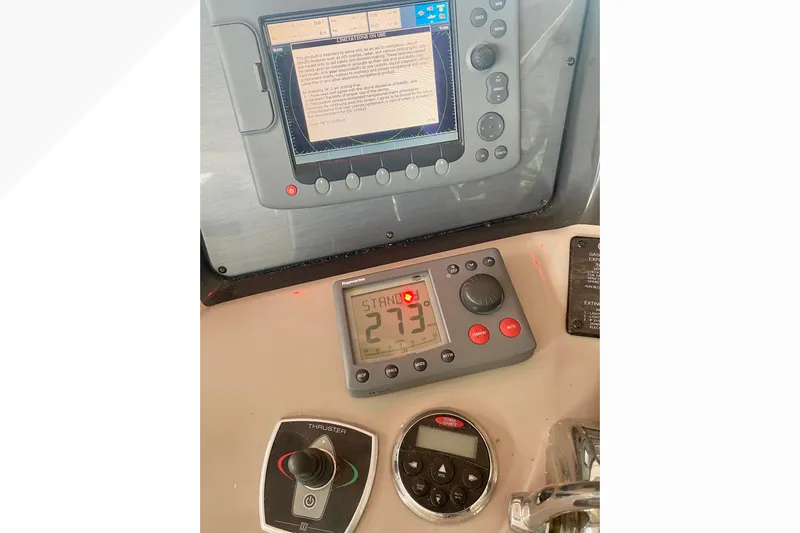  Yacht Photos Pics Control panel of a 2007 Sea Ray 38 Sundancer boat with navigation and thruster controls.