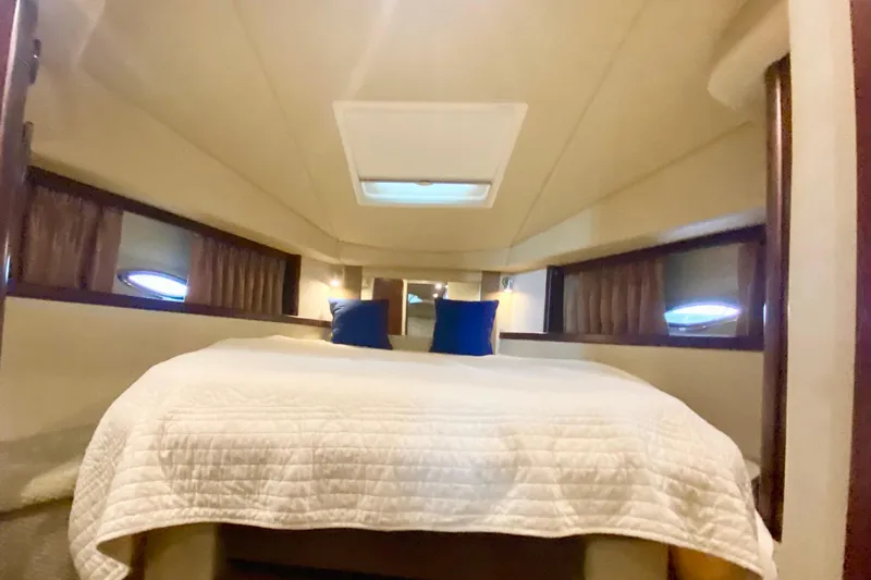  Yacht Photos Pics Luxurious cabin interior of 2007 Sea Ray 38 Sundancer yacht with cozy bedding.