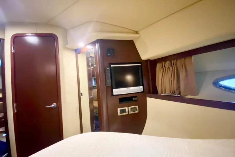  Yacht Photos Pics Interior cabin of 2007 Sea Ray 38 Sundancer with TV and wood accents.