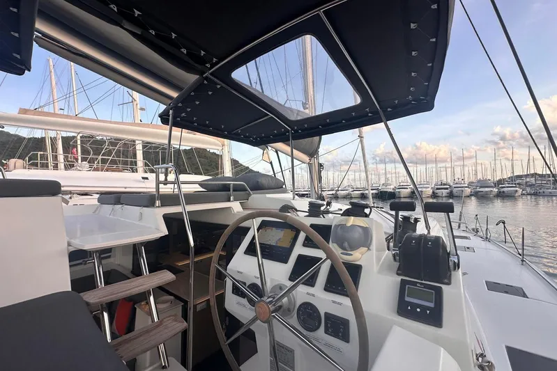  Yacht Photos Pics Cockpit view of 2020 Fountaine Pajot Saona 47 catamaran in marina setting.
