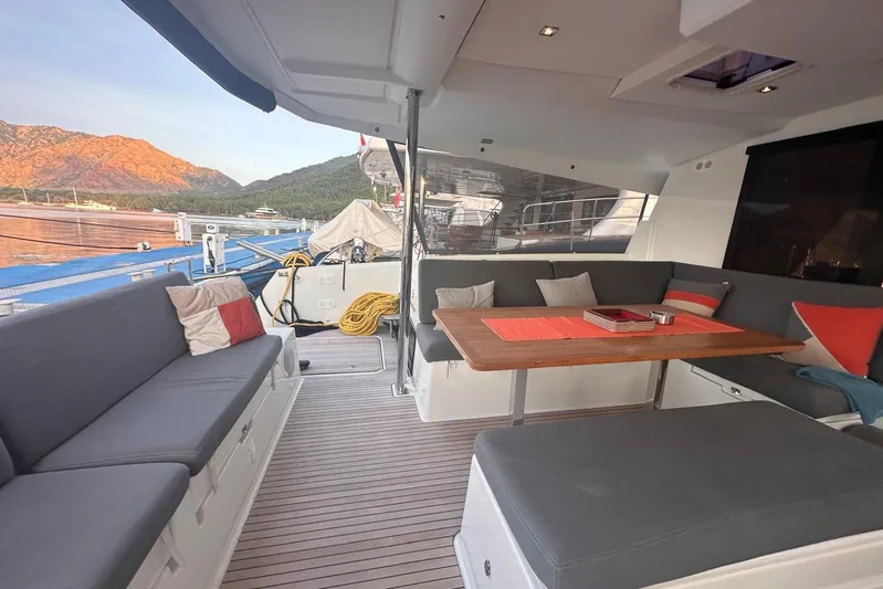  Yacht Photos Pics Luxurious 2020 Fountaine Pajot Saona 47 yacht interior with comfortable seating and scenic view.