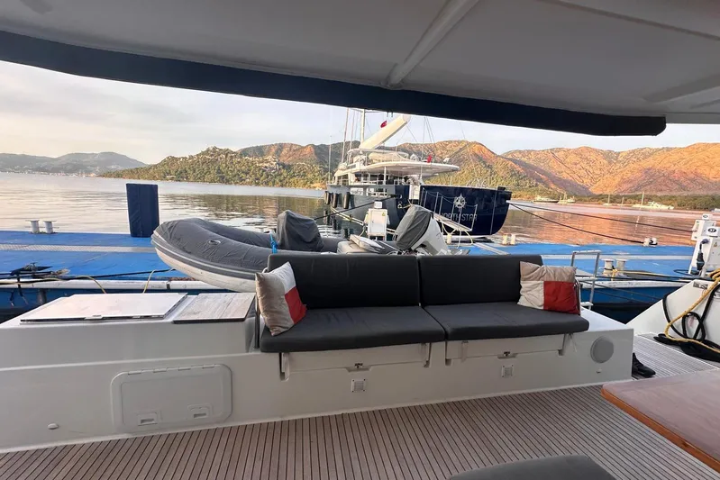  Yacht Photos Pics 2020 Fountaine Pajot Saona 47 yacht docked with scenic mountain backdrop.