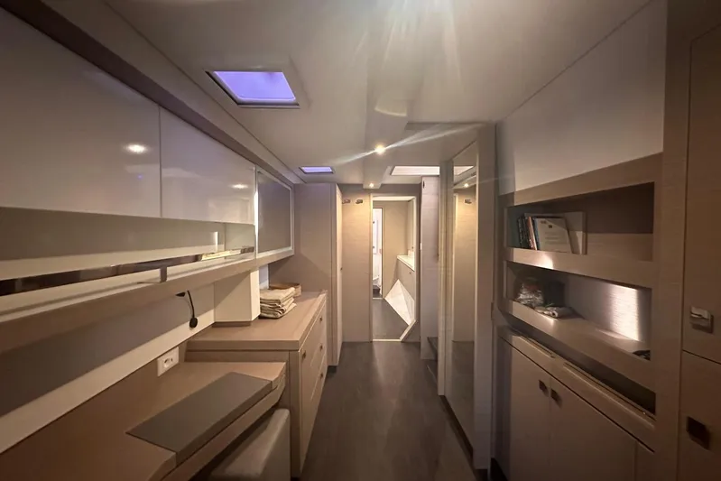  Yacht Photos Pics Luxurious interior of 2020 Fountaine Pajot Saona 47 catamaran, featuring modern design and ample storage.