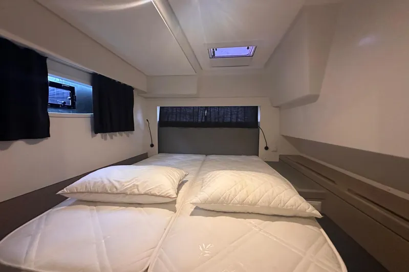  Yacht Photos Pics Interior cabin of 2020 Fountaine Pajot Saona 47 catamaran with cozy bedding.