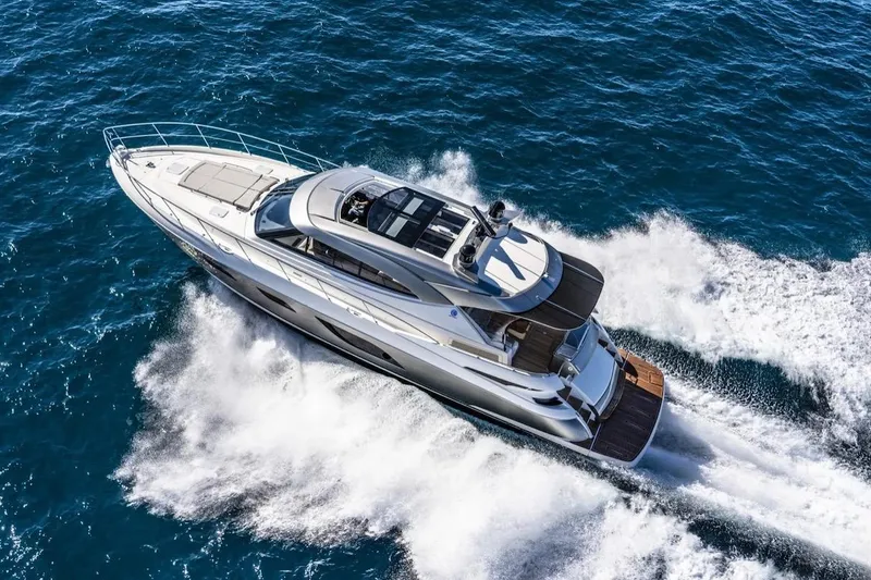 Mon Trésor Yacht Photos Pics 2020 Riviera 6000 Sport Yacht Platinum Edition cruising on open water.