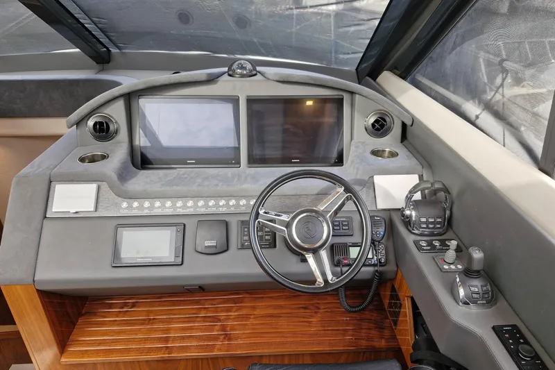 Mon Trésor Yacht Photos Pics Cockpit of 2020 Riviera 6000 Sport Yacht Platinum Edition with advanced navigation controls.