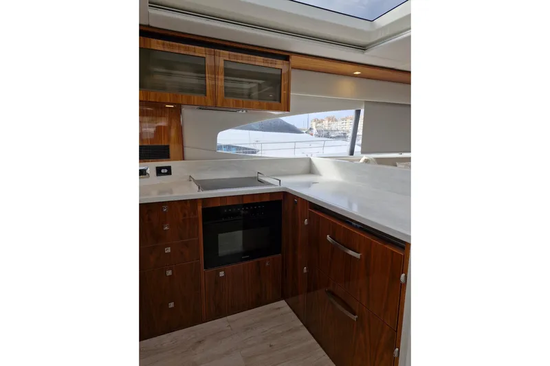 Mon Trésor Yacht Photos Pics Luxurious kitchen interior of 2020 Riviera 6000 Sport Yacht Platinum Edition.