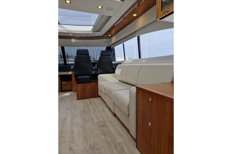 Mon Trésor Yacht Photos Pics Interior of 2020 Riviera 6000 Sport Yacht Platinum Edition with luxurious seating and modern design.