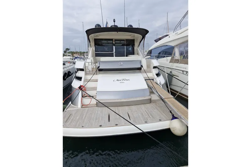 Mon Trésor Yacht Photos Pics 2020 Riviera 6000 Sport Yacht Platinum Edition docked at marina.