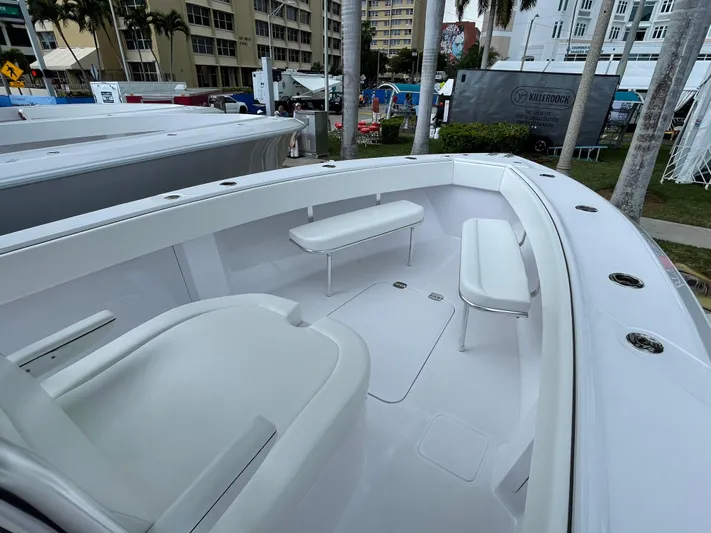 Reel Chaos Yacht Photos Pics 2022 Bahama 35 Open boat interior with white seating and sleek design.
