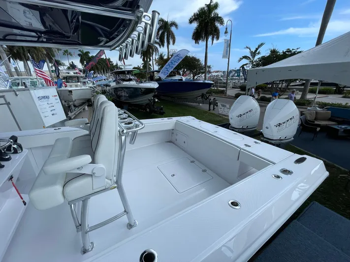 Reel Chaos Yacht Photos Pics 2022 Bahama 35 Open boat with dual engines, showcased outdoors at a marine event.