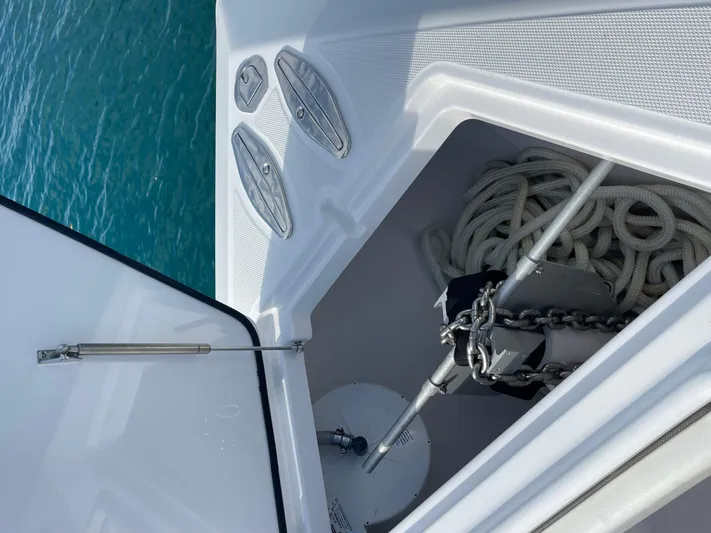 Reel Chaos Yacht Photos Pics Anchor compartment of 2022 Bahama 35 Open boat with coiled rope and chain.