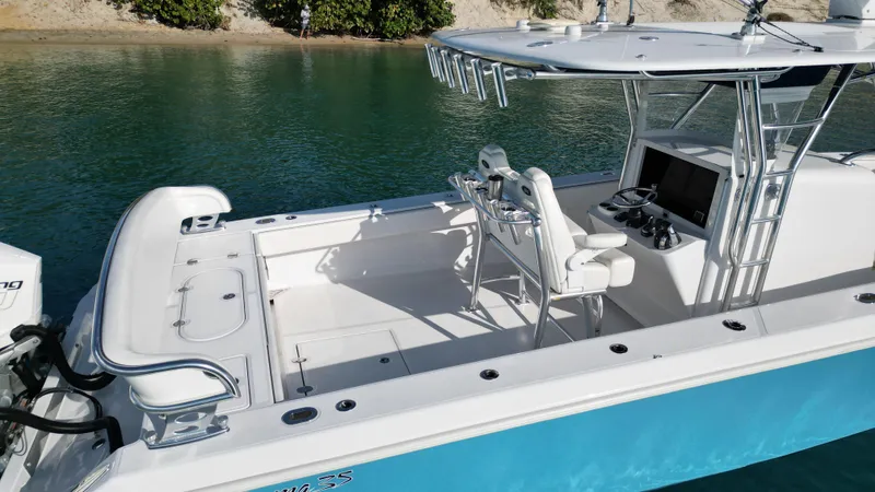 Reel Chaos Yacht Photos Pics 2022 Bahama 35 Open boat with sleek design, spacious deck, and modern controls.