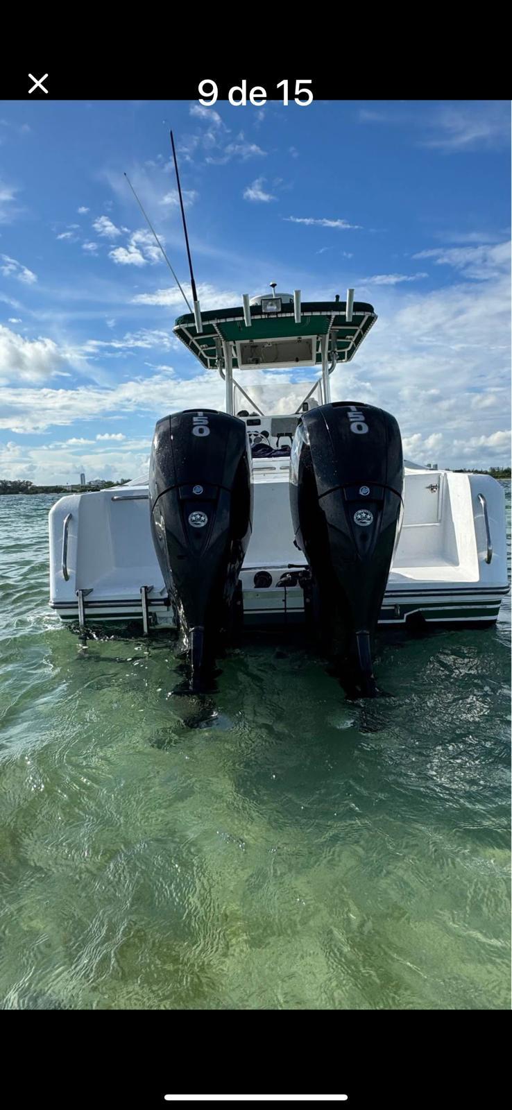 2000 Stamas 250 Tarpon boat with dual outboard motors on clear water.