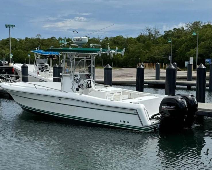 2000 Stamas 250 Tarpon boat docked with twin Mercury engines.