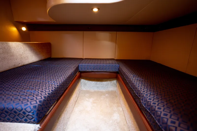 Seacougs Yacht Photos Pics 2008 Meridian 341 Sedan interior cabin with blue patterned seating and warm lighting.
