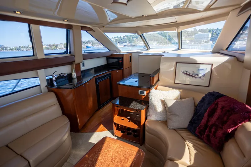 Seacougs Yacht Photos Pics Luxurious interior of a 2008 Meridian 341 Sedan yacht with plush seating and modern amenities.