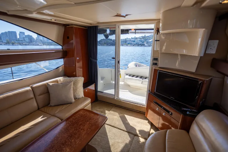 Seacougs Yacht Photos Pics Interior of 2008 Meridian 341 Sedan yacht with city skyline view through window.