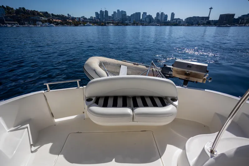 Seacougs Yacht Photos Pics 2008 Meridian 341 Sedan boat with city skyline view in the background.