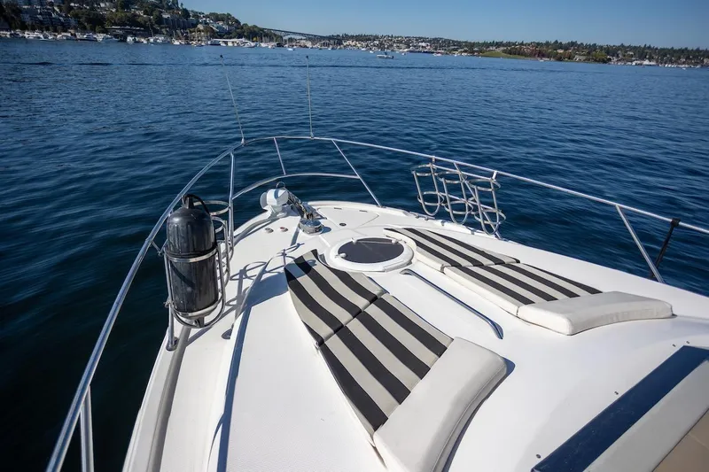 Seacougs Yacht Photos Pics 2008 Meridian 341 Sedan yacht deck with striped cushions on a sunny day at sea.