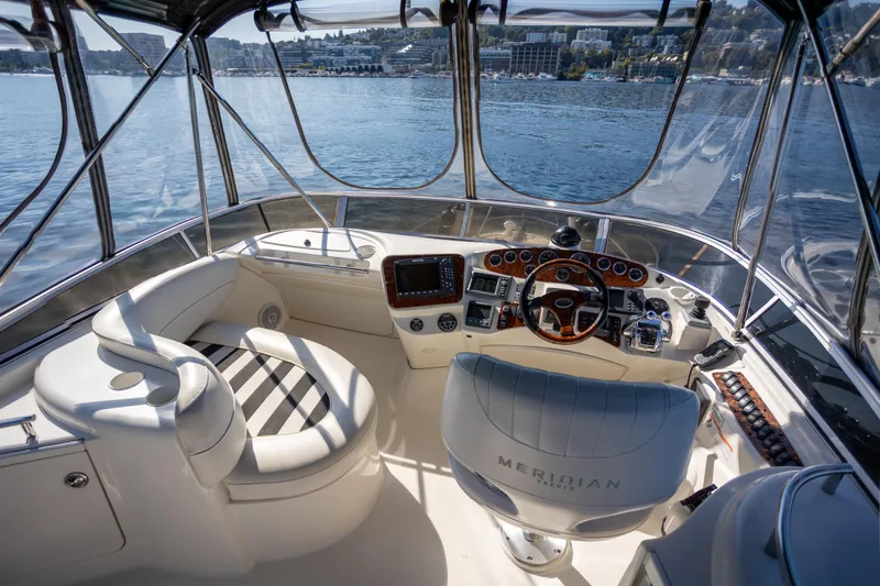 Seacougs Yacht Photos Pics 2008 Meridian 341 Sedan yacht cockpit with luxurious seating and navigation controls.