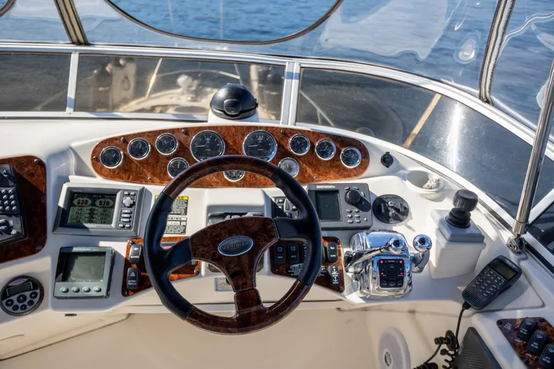 Seacougs Yacht Photos Pics 2008 Meridian 341 Sedan helm with navigation instruments and steering wheel.