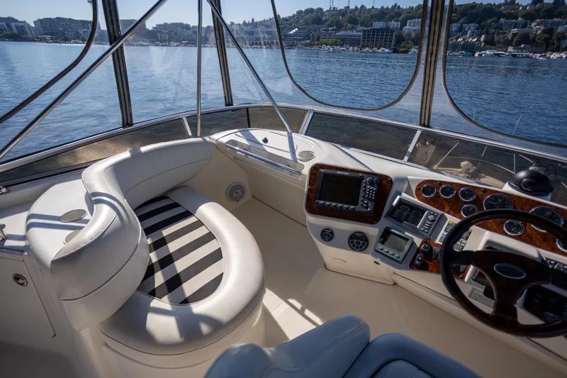 Seacougs Yacht Photos Pics Luxurious 2008 Meridian 341 Sedan yacht interior with modern navigation equipment and scenic waterfront view.