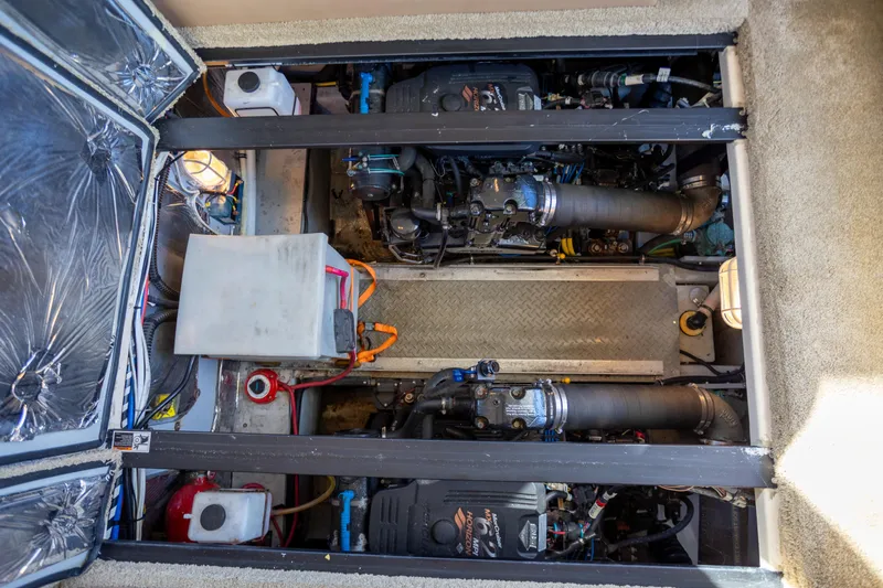 Seacougs Yacht Photos Pics Engine compartment of a 2008 Meridian 341 Sedan, showcasing dual engines and mechanical components.