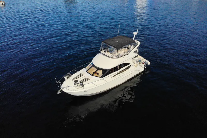 Seacougs Yacht Photos Pics 2008 Meridian 341 Sedan yacht cruising on calm blue waters.