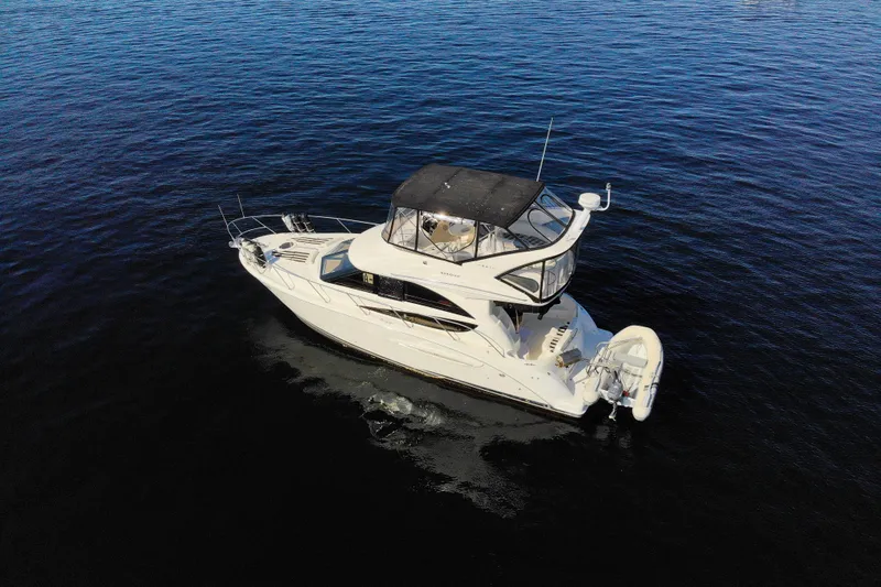 Seacougs Yacht Photos Pics 2008 Meridian 341 Sedan yacht cruising on calm blue waters.