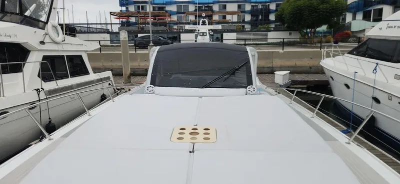 Catch And Release Yacht Photos Pics Luxury Trident Custom 2017 yacht docked at marina, surrounded by other boats.